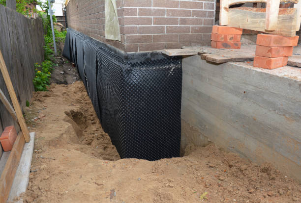 Happy homeowners after waterproofing job in Mendon